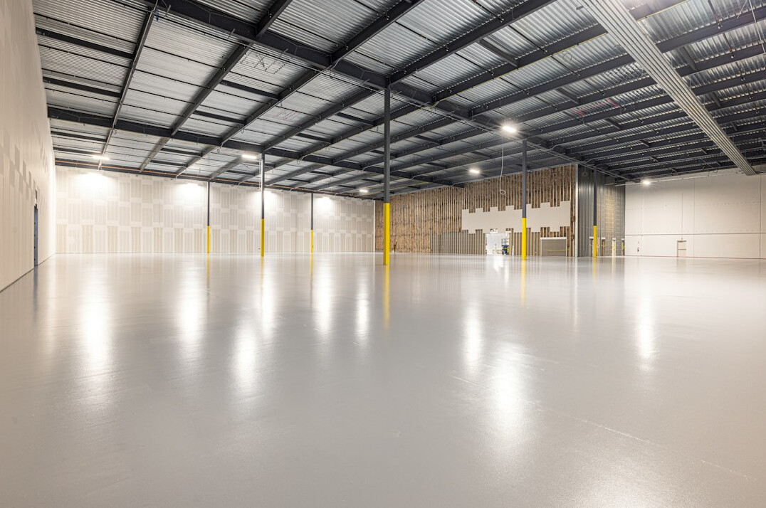 Modern industrial warehouse floor with organized shelving
